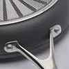 A close-up view of the underside of a frying pan, showing the handle attachment. Náhľad obrázku produktu