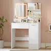 A white vanity table with a lighted mirror, shelves, and storage is set up in a room with pink and beige walls. Produktbild-Vorschau