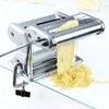 A chrome pasta maker is shown on a glass table, producing fresh pasta. Náhľad obrázku produktu