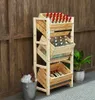 A wooden crate rack with three tiers, holding bottles of drinks, placed against a wooden wall. Produktbild-Vorschau