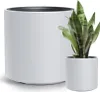 Two white planters are shown, one larger and one smaller, with a snake plant in the smaller one. The larger planter is in the foreground and the smaller planter with the plant is in the midground. Náhled obrázku produktu