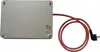 A silver rectangular device with a red power cord and plug is shown on a white background. Náhľad obrázku produktu
