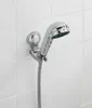 A chrome shower head holder mounted on a white tiled wall. Anteprima dell’immagine prodotto
