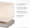 A close-up of a modern table lamp with descriptive text highlighting its features. Anteprima dell’immagine prodotto
