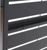 A close-up view of a black metal slat wall panel. Voir les images du produit