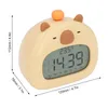 A digital alarm clock shaped like a cartoon bear, with dimensions indicated by measurement lines. Náhled obrázku produktu