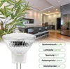 A product shot of an LED bulb in the foreground, with a modern kitchen interior in the background. Produktbild-Vorschau