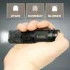 A hand holding a black flashlight with three icons above showing different light modes. Produktbild-Vorschau