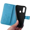 A hand holding a blue flip phone case open to show the inside. Produktbild-Vorschau