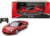 A red Ferrari 296 GTS remote-controlled car and its controller are displayed against a white background, with the product packaging visible in the upper portion of the image. Produktbild-Vorschau