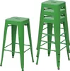 Two green metal bar stools are shown against a white background. One stool is standing alone, and the other is part of a stack of three stools. Voir les images du produit