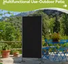 An outdoor patio scene with a black room divider set up on a balcony, with plants and outdoor furniture visible. Náhľad obrázku produktu