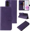 A collage of images showing a purple floral and butterfly embossed flip phone case for a Samsung Galaxy A36 5G. Produktbild-Vorschau