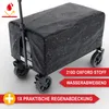 A black foldable wagon covered with a protective rain cover, showing water droplets on the cover. Produktbild-Vorschau