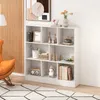 A white bookshelf filled with decorative items and books, placed in a room with a wooden accent wall and an orange chair. Náhľad obrázku produktu