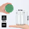 A hand holding a green checkered lid over a clear glass jar, with dimensions and weight information displayed. Podgląd zdjęcia produktu