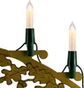 Close-up of two candle-shaped lights attached to a decorative golden branch with oak leaf motifs. Produktbild-Vorschau