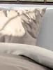 A close-up view of a pillow and bedding. Produktbild-Vorschau