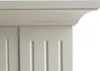 A close-up view of the top decorative molding and fluted details of a beige fireplace. Produktbild-Vorschau