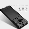 A black phone case with a brushed texture and a circular camera cutout is shown from a diagonal angle. Produktbild-Vorschau