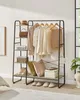 A clothing rack with various garments, accessories, and decorative items displayed on shelves. Produktbild-Vorschau