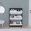 A shoe cabinet filled with shoes next to a stool and a mirror. Náhled obrázku produktu
