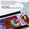 A hand holding a stylus pen over a tablet screen displaying a colorful digital painting. Voir les images du produit