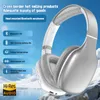 A pair of silver and white over-ear headphones are shown against a backdrop of a snowy mountain landscape and a body of water. Náhľad obrázku produktu