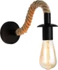 A single wall lamp with a black base and a rope arm holding a light bulb. Náhľad obrázku produktu