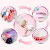 Pink-weiße Blasenpistole mit mehreren kreisförmigen Einschüben, die die Verwendung zeigen: Batterie einlegen, Lösung einfüllen, eintauchen und Blasen mit Licht schießen Náhled obrázku produktu