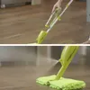 A person is using a spray mop to clean a wooden floor. Produktbild-Vorschau