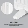Close-up of a white heater's stand and wall-mounting feature, with text describing its safe stand options. Náhled obrázku produktu