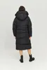 A woman wearing a black puffer coat and boots, viewed from the back. Produktbild-Vorschau