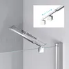 A shower stabilizer bar mounted on a wall, with a glass shower wall below it. Produktbild-Vorschau