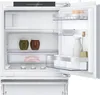 The interior of a white refrigerator with the door open, showing shelves, drawers, and various food items. Produktbild-Vorschau