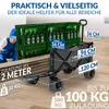 A person in work clothes is loading green crates of beer bottles into a black foldable wagon. The wagon has dimensions and weight capacity indicated by text overlays. Produktbild-Vorschau