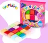 A product shot of edible sugar dough in various colors, both in its packaging and loose in a tray, with the brand logo and product details visible. Produktbild-Vorschau