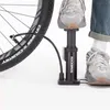 A person is using a bicycle pump to inflate a bicycle tire. Produktbild-Vorschau