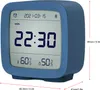 A blue digital alarm clock displaying the time, date, day of the week, temperature, and humidity. Podgląd zdjęcia produktu