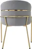 A gray upholstered chair with gold metal legs, shown from the back. Náhled obrázku produktu