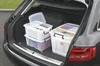 The image shows several clear storage boxes filled with files and other items, placed in the trunk of a car. Anteprima dell’immagine prodotto