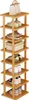 A multi-tier wooden shoe rack with various shoes and a handbag on it. Produktbild-Vorschau