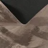 A close-up view of the underside and edge of a rug, showing the textured backing and the soft, high-pile material. Produktbild-Vorschau
