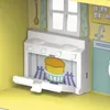 A toy kitchen stove with a cake inside. Náhľad obrázku produktu