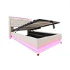 A beige upholstered storage bed with LED lighting. Anteprima dell’immagine prodotto