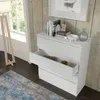 A white dresser with an open drawer is shown in a room with wooden walls and a blue and gray rug. Produktbild-Vorschau