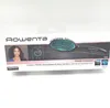 The image shows the retail packaging of a Rowenta Power Straight hair straightening brush. The packaging features a picture of the product, a model demonstrating its use, and text highlighting its features and benefits. Produktbild-Vorschau