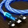 A close-up of a glowing blue charging cable with magnetic adapters on a wooden surface. Produktbild-Vorschau