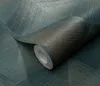 A roll of teal and brown textured wallpaper is shown, with a geometric pattern visible on the unrolled section. Podgląd zdjęcia produktu