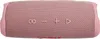 A pink JBL Flip 6 portable speaker is shown from a top-down perspective against a white background. The speaker has a textured fabric surface and visible control buttons. Voir les images du produit